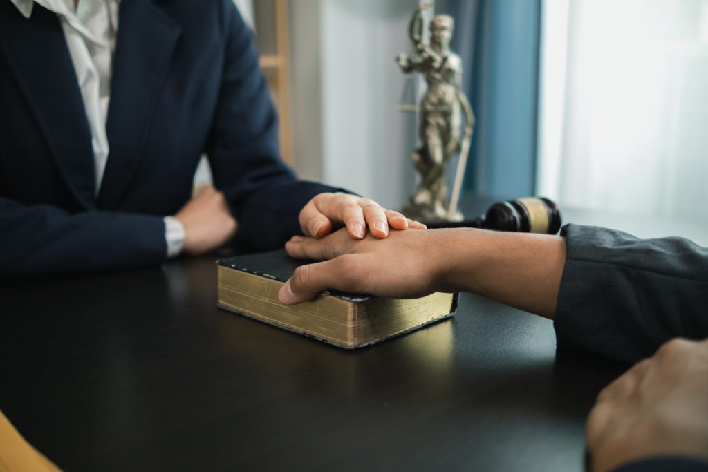 A Bible is placed on the table in the law office so that the defendant can swear before the Bible that he will testify truthfully and with the power of faith in God that the defendant will not lie.