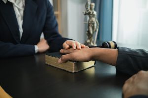 A Bible is placed on the table in the law office so that the defendant can swear before the Bible that he will testify truthfully and with the power of faith in God that the defendant will not lie.