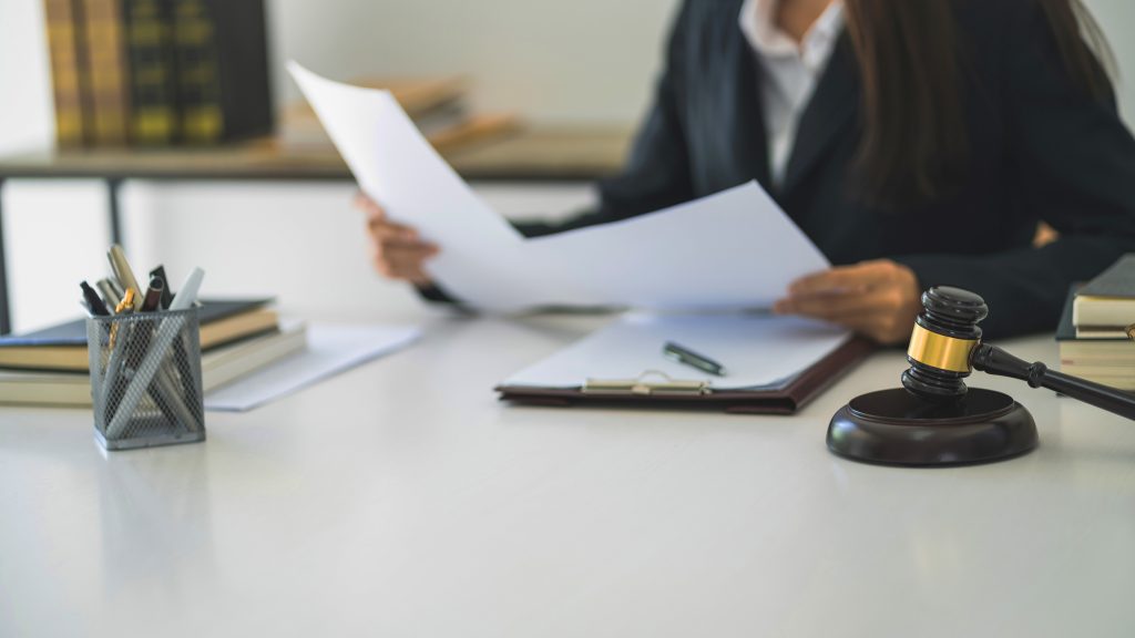 Lawyer businesswoman workingÂ with consult. Legal law Judge Gavel Scale of Justice concept