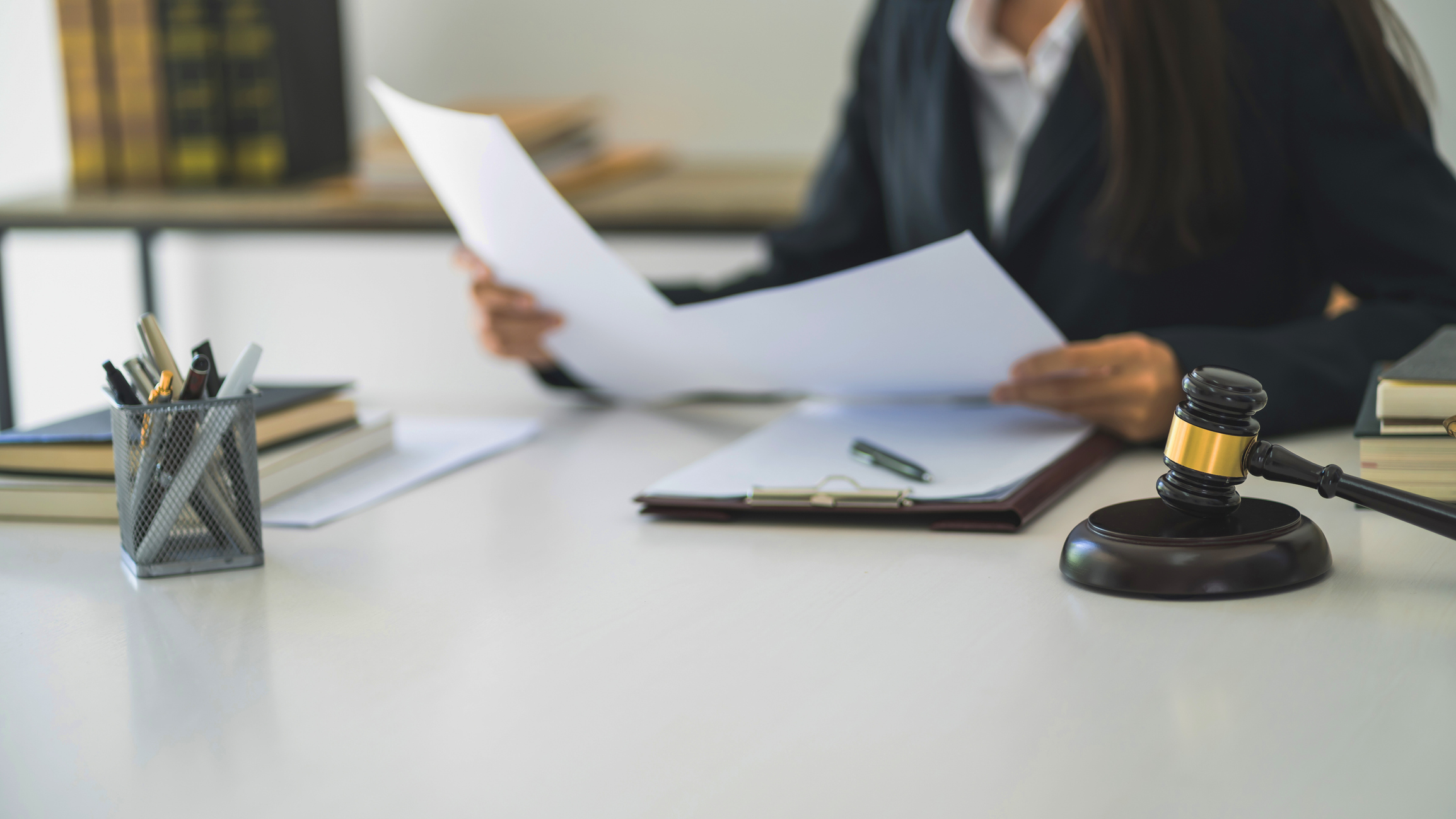 Lawyer businesswoman workingÂ with consult. Legal law Judge Gavel Scale of Justice concept